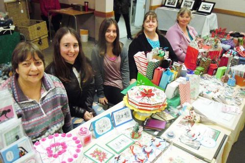 vendors Karen, Abby, Alyssa, Sue and Lisa of Lisa's Crafts and 2 Sisters in a craft room at the Roberta Struthers sale at the Golden Links Hall in Harrowsmith